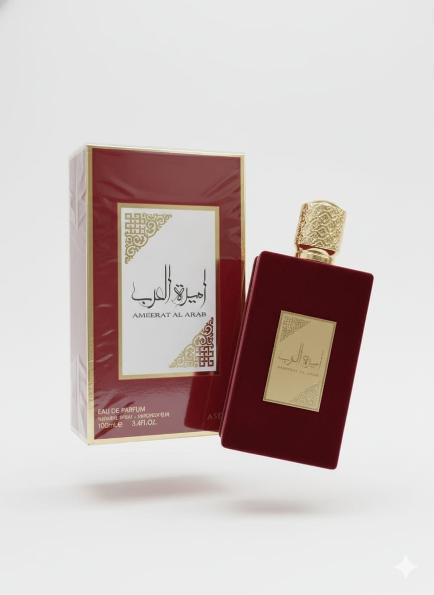 زجاجة عطر أميرة العرب باللون الأحمر الداكن مع علبة المنتج الذهبية والحمراء